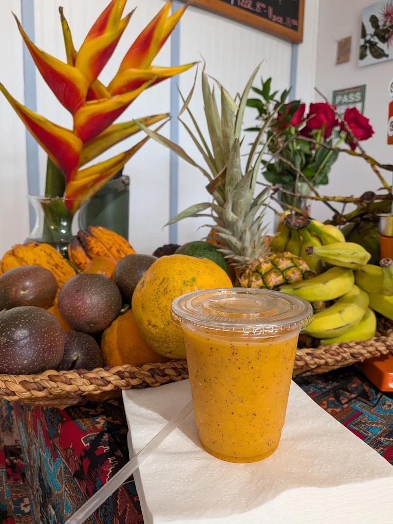 Fresh tropical smoothie with pineapple, papaya and lilikoi