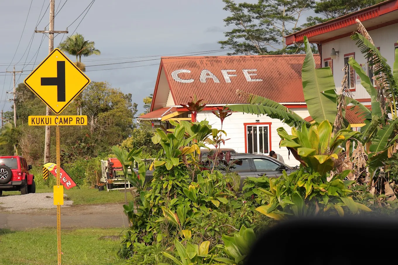 The Ōhi'a Lehua Café building on Kukui Camp Rd, red roof lettered CAFE